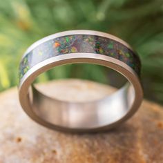 a wedding ring with an opalite inlay