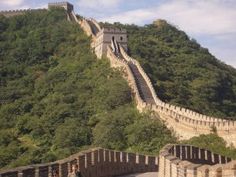 the great wall of china with people walking on it