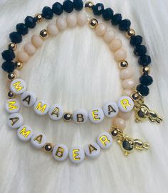 This listing consist of two different colors, Mama Bear bracelets. The first bracelet is black with gold hematite and a gold plated bear charm. The second one is a cream color with gold hematite add a goldplated there. These bracelets are perfect for Mother's Day. The size for the bracelets is 7 inches. You may request custom sizes in the personalization box. We can make bracelets for children as well, but please measure their wrists for the most accurate sizing. but know it may not be a perfect fit unless you provide exact measurements.  . These make perfect gifts for moms, grandmas, sisters, brides to be, bridesmaids, girls, baby shower, graduations, birthdays, bachelorette party, best friends, teachers... the list never ends :)  Please allow 1- 5 days processing time when you purchase, Custom Name Black Bracelet For Mother's Day, Customized Black Name Bracelet For Mother's Day, Customizable Black Stretch Bracelet For Personalized Gift, Personalized Black Stretch Bracelet With Letter Beads, Everyday Black Stretch Bracelet With Custom Name, Mother's Day Black Name Bracelet With Letter Beads, Party Best Friends, Mothers Days, Zodiac Bracelet