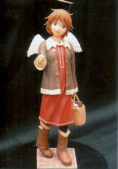 a figurine of an angel holding a basket