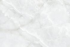 a white marble textured background with some black dots