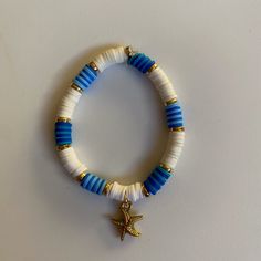 Blue & white themed starfish charm bracelet Adjustable Blue Jewelry With Starfish Charm, White Star-shaped Jewelry With Starfish Charm, Adjustable Blue Starfish Jewelry, Adjustable Blue Bracelets With Starfish Charm, Blue Star Jewelry For Vacation, Blue Star Shaped Jewelry For Vacation, Blue Bracelets With Starfish Charm Ocean-inspired, Blue Beaded Bracelet With Starfish Charm, White Star-shaped Ocean-inspired Jewelry