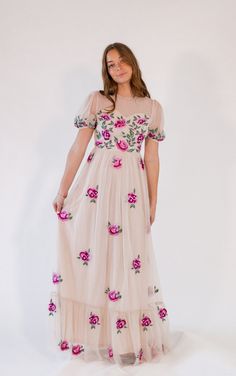 + neutral tan with colorful hand-finished floral embroidery+ subtle tulle puff sleeves+ maxi length with sweetheart neckline * Runs small, size up, if in between Spring Floral Embroidered Maxi Dress For Prom, Spring Prom Maxi Dress With Floral Embroidery, Floral Embellished Maxi Dress For Spring Prom, Spring Embroidered Maxi Dress For Prom, Floral Embroidered Maxi Dress With Fitted Bodice, Fitted Floral Maxi Dress For Garden Party, Fitted Floral Embroidery Maxi Dress For Garden Party, Cream Maxi Dress With Floral Embroidery, Spring Tulle Maxi Dress For Garden Party