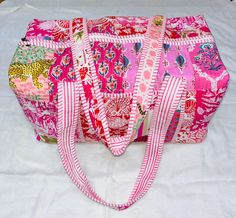 Cotton Quilted  block print weekend bags YOU WILL GET ASSORTED PATCHES ( In This Video Bag Size 24 x 12 x 12)  100% cotton fabric SIZE:  medium : 16" x 8" x 8 " large : 18" x 9" x 9 Big Size :20" x 10" x 10"  the bags feature two pockets each on the outside   :Color : Assorted & We Have More Color  : Quilted Padding   great for weekend getaways, beach trips and as carry on bags while travelling Ask me for custom orders, personalized pouches or wholesale  CARE: Machine wash separately in cold water Pink Rectangular Everyday Duffle Bag, Pink Rectangular Duffle Bag, Large Capacity Rectangular Pink Weekender Bag, Large Capacity Pink Rectangular Duffle Bag, Pink Rectangular Travel Bag For Daily Use, Pink Rectangular Travel Bag As Gift, Pink Rectangular Travel Bag For Gift, Pink Rectangular Weekender Bag, Pink Rectangular Patchwork Bag