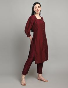 "Dress like royalty with our \"Royal Elegance\" kurta set, crafted from high-quality cotton silk fabric. The deep purple color and solid print give a classic and sophisticated touch to this traditional outfit. The bishop sleeves provide an elegant and flowy look, while the straight cut kurta adds a modern twist to the design. The square neck brings a contemporary edge to the overall look, making it perfect for any occasion, be it formal or casual." Festive Cotton Silk Kurta With Set-in Sleeves, Elegant Cotton Sets For Designer Wear, Elegant Straight Kurta With Set-in Sleeves, Traditional Silk Kurta With Set-in Sleeves, Elegant Designer Cotton Salwar Kameez, Festive Straight Kurta With Set-in Sleeves, Elegant Cotton Salwar Kameez For Diwali, Elegant Cotton Sets For Festive Occasions, Elegant Purple Cotton Sets