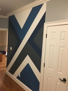 a room painted with blue and white stripes