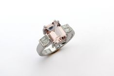 "This luxurious engagement ring is hard to ignore! It has a beautiful combination of colors and shapes, made with premium quality materials, designed in clean precise geometric lines, and has a lot of presence and beauty. The contrast between the pink Morganite and the clear diamonds is eye-catching and impressive. Get this art deco engagement ring for the woman who has your heart and she will say \"yes!\" and wear this elegant engagement ring every day for the rest of her life! ✿ Item details ✿ Modern Rings With Octagon Center Stone, Modern Octagon Rings With Center Stone, Modern Rings With Baguette Diamonds, Modern Platinum Rings With Baguette Diamonds, Modern Octagon Ring With Accent Stones, Modern Octagon Rings With Accent Stones, Modern Diamond Baguette Cut Rings, Modern Baguette Cut Rings With Accent Stones, Modern Rectangular Diamond Ring With Center Stone