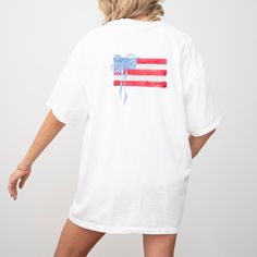 4th of July Shirt Womens 4th of July Outfit Women American Flag Shirt July 4th T Shirt USA Shirt Coquette July 4th T-Shirt Monogram Shirt 𝐏𝐑𝐎𝐃𝐔𝐂𝐓 𝐃𝐄𝐓𝐀𝐈𝐋𝐒 * 100% ring-spun cotton * Left chest pocket * Crewneck, short-sleeved t-shirt * Relaxed fit, unisex sizing * Image & text are printed with ink (DTG printing) * Comfort Colors brand 𝐇𝐎𝐖 𝐓𝐎 𝐎𝐑𝐃𝐄𝐑 * Select your desired t-shirt color * Select your size (*Please refer to the size chart in the listing images to ensure correct Americana Style Shirt With Flag Print For Independence Day, 4th Of July Cotton Graphic Tee Shirt, 4th Of July Relaxed Fit Short Sleeve Shirt, 4th Of July Short Sleeve Relaxed Fit Shirt, Relaxed Fit Flag Print Shirt For 4th Of July, Americana Cotton Shirt For Memorial Day, Patriotic Pre-shrunk Shirt For 4th Of July, 4th Of July Cotton Graphic Tee, Memorial Day Americana Cotton Shirt