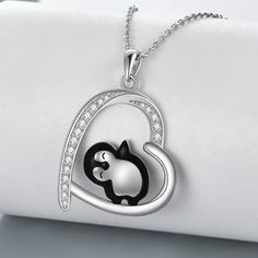 Introducing our charming Penguin Necklace, featuring a heart-shaped penguin design that symbolizes everlasting friendship. This necklace makes a fantastic gift for women who have a deep affection for penguins, whether they are sisters, brothers, or dear friends. Crafted from Hypoallergenic real 925 sterling silver, this Penguin Necklace prioritizes your health and comfort. It's Nickel-free, Lead-free, and Cadmium-free, ensuring that long-term wear keeps you in good health. The penguin pendant measures 21.8 mm by 29.8 mm (0.86 inches by 1.17 inches) and hangs gracefully from a 1.2 mm O chain that's 18 inches long. This necklace is a delightful accessory that beautifully captures the essence of friendship and love. Wear it proudly to symbolize your cherished relationships and your affection Penguin Pendant, Penguin Jewelry, Penguin Necklace, Penguin Design, Silver Sisters, Sunflower Jewelry, Sterling Silver Cross Necklace, Sunflower Pendant, Sterling Silver Heart Pendant