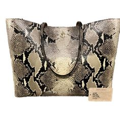 The Jimmy Choo Martina Snake Print Leather Tote is a must have. Crafted in soft calfskin leather with a light stone snake print and roomy should straps. Features a large interior perfect for holding your essentials or would be a great work tote. The front features the iconice JC logo emblem. Pair it with the Jimmy Choo Light Stone Snake Print Card Case for a complete look! Model: OPSL | 028 Dual top handles Magnetic closure Zip pouch Snake-printed leather Lining: Polyurethane/nylon Measures: 14" Jimmy Choo Perfume, Fringe Tote Bag, Suede Tote Bag, Leopard Bag, Large Leather Tote Bag, Jimmy Choo Bag, Suede Tote, Black Leather Tote Bag, Logo Emblem