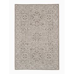 a beige and white rug with an intricate design on the bottom, in front of a white background