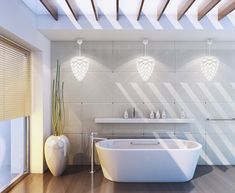 a white bath tub sitting in a bathroom next to a sink and window with wooden slats on the ceiling