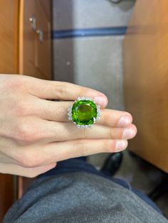 A stunning ring featuring a 54.29 Burmese peridot of the finest quality in the middle. A completely clean stone in a strong apple green color. Surrounded with 2.00 carats of white diamonds. Apple Green Color, Apple Green, Burmese, White Diamonds, Rings Statement, Diamond White, Green Color, Green Colors, Statement Rings