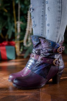 Indulge in luxury with our SOFFIA Floral Embossed Buckle Up Leather Bootie in purple. The intricate floral embossing and chic buckle detail elevate this bootie to a new level of sophistication. Crafted with premium leather, it offers comfort and style for any occasion. Step out in style with SOFFIA. 1.96" heel 5.2" shaft 11.4'' circumference Zip & buckle closure Leather upper Leather lining Leather midsole Leather insole Rubber sole Reindeer Headband, Daily Dress, Dress Jewelry, Leather Booties, Purple Floral, Shoe Shop, Embossed Leather, Bootie, Fashion Statement