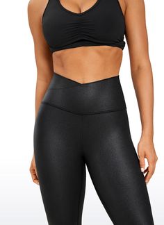 a woman in black sports bra top and leggings with her hands on her hips