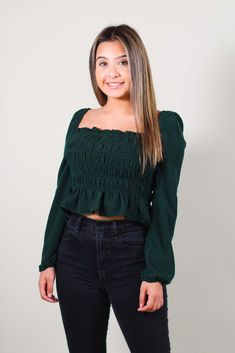 Absolutely adorable top with a ruffled square neckline and long elasticized sleeves. Featuring smocking at back, and a slightly cropped hem is perfect for pairing with high waist bottoms! -Color: Dark Green -Elasticized sleeves -Content: 100% Polyester -Imported -Runs true to size -Model is 5'1" and wearing size Small Fall Tops With Elastic Sleeves And Square Neck, Chic Green Top With Elastic Sleeves, Trendy Ruffled Square Neck Crop Top, Casual Smocked Top With Square Neck For Brunch, Chic Smocked Top With Square Neck And Elastic Sleeves, Fall Ruched Smocked Top With Square Neck, Casual Smocked Top With Square Neck, Casual Smocked Top With Square Neck And Elastic Sleeves, Fall Smocked Top With Ruched Detail And Square Neck