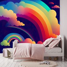 a bedroom with a rainbow mural on the wall