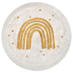 a white and gold rug with a rainbow on it