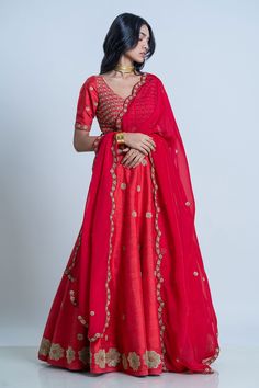 Red raw silk floral embroidered lehenga with attached cancan. Paired with wide V-neck padded blouse and dupatta.
Component: 3
Pattern: Embroidery
Type Of Work: Floral
Neckline: Wide V
Sleeve Type: Half
Fabric: Blouse and Lehenga: Raw Silk; Dupatta: Organza
Color: Red
Other Details: 
Lehenga Length: 42 inches
Scallop embroidered border dupatta
Tassel tie-up detailing
Note: The neckpiece worn by the model is not for sale
Occasion: Bride,Wedding - Aza Fashions Red Resham Embroidery Pre-draped Saree For Wedding, Unstitched Red Lehenga For Reception, Transitional Silk Choli With Resham Embroidery, Red Unstitched Lehenga With Traditional Drape, Red Unstitched Lehenga In Traditional Drape, Unstitched Red Lehenga With Traditional Drape, Unstitched Red Lehenga In Traditional Drape, Festive Silk Lehenga With Zari Work, Festive Silk Lehenga With Intricate Embroidery