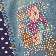 the back of a pair of jeans with an image of a woman's face on it