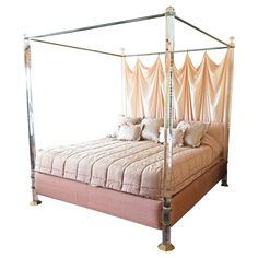 a four poster bed with pink sheets and pillows on it's headboard, in front of a white background