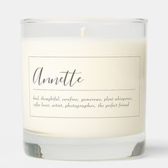 an unpeeled candle with the word annette on it's label in front of a white background