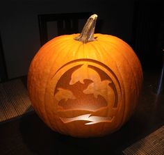 a carved pumpkin sitting on top of a table