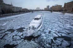 a boat is traveling through the icy water