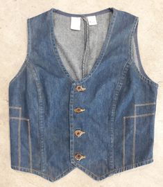 "Wrangler cool denim women's vest size large. Good condition,cowgirl country western style, 65% cotton 35% polyesters. Please, check carefully the measurements, photos and description of the article before buying it, we do not accept changes or returns. Measuraments lying face down from outside: 17\" Across chest underarm to underarm. 13\" Shoulder seam to seam.. 13\" Long, front middle top to bottom. Let me know if you have any questions or would like to see additional photos. International buy Fitted Cotton Denim Vest Top, Fitted Denim Vest Top, Fitted Dark Wash Cotton Vest, Fitted Dark Wash Denim Vest Top, Fitted Western Dark Wash Denim Jacket, Fitted Dark Wash Western Denim Jacket, Western Style Fitted Dark Wash Denim Jacket, Fitted Dark Wash Vest With Pockets, Western Denim Vest For Fall