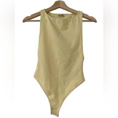 Free People Bodysuit Size Xs Color: Pale Yellow Nwt (New With Tags) Summer Basic Fitted Bodysuit, Basic Fitted Summer Bodysuit, Basic Fitted Bodysuit For Summer, Basic Fitted Swimwear For Summer, Summer Basic Bodysuit, Stretch Cotton One-piece Bodysuit, Summer Cotton Solid Color Bodysuit, Cotton Swimwear For Spring, Yellow Fitted Cotton Swimwear