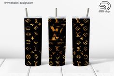 two black and gold lighters with louis vuitton designs on them are shown