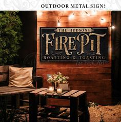 the outdoor metal sign for fire pit roasting and toasting is lit up at night