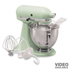 a green mixer and whisk attachment with the words video available on it's side