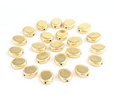 gold plated metal buttons on white background