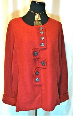 a red jacket with buttons is on display