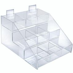 three clear acrylic drawers are stacked on top of each other in the shape of a triangle