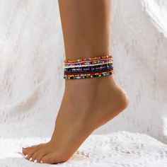 Bring vibrant color to your accessory collection with this set of stretch anklets featuring colorful howlite beads. Includes 10 beaded stretch anklets 8.6" L Stretch Howlite / acrylic Trendy Tiny Beads Anklets For Summer, Trendy Summer Anklet With Tiny Beads, Trendy Summer Anklets With Round Beads, Trendy Beaded Festival Anklets, Trendy Beaded Anklets For Festival, Trendy Anklets With Round Beads For Festivals, Trendy Multicolor Round Bead Anklets, Trendy Multicolor Anklets With Round Beads, Trendy Multicolor Beaded Anklets