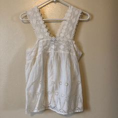 This Nwt. American Eagle Eyelet Tank Top Is Gorgeous. In Excellent Condition. Peasant Top. White Crochet Top For Day Out, Chic White Crochet Top For Summer, Chic White Crochet Top For Spring, White Feminine Crochet Top For Brunch, White Tank Top For Brunch, Casual White Crochet Top With Lace Details, White Lace Cotton Tank Top, Casual White Lace Crochet Top, White Cotton Tank Top With Crochet Trim