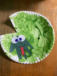 a paper plate with a green monster on it