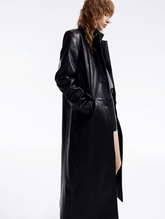 MO&Co. Women's Long Line Leather Coat Indulge in luxury with our overcoat. Crafted from comfortable and glossy faux leather, this coat features a straight and structured silhouette with padded shoulders and a single-button closure. With its chic and sophisticated design, it's the epitome of style and elegance. Features : - Structured straight-cut maxi silhouette- Padded shoulder, classic lapel collar- Single-breasted, side flap pockets Code: MBD1OVC007The back length of size S is 116cmMATERIALS Denim Cotton, Leather Collar, Sophisticated Design, Denim Coat, Lapel Collar, Back To Black, Leather Coat, Straight Cut, Black Coat