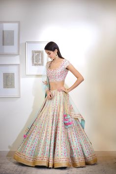 This set features a gota and thread embroidered multi-color lehenga set. Color: Blue Fabric: Silk; Viscose Embroidery Details: Gota And Thread Care: Dry Clean Only