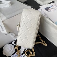 Color: White. 100% Calf Leather. Calf leather lining. Gold toned hardware. Twist lock closure. Camelia flower long chain strap. Inside zipped pocket. Inside flat pocket. Backside flat pocket. Shoulder and crossbody carry. Size: 18 × 13 × 7 cm. Made in Italy. Chanel box, dust bag and booklets included. Chanel Box, Luxury Bag, Long Chain, Chain Bags, Chain Strap, Chanel Bag, Luxury Bags, Calf Leather, Calf Skin