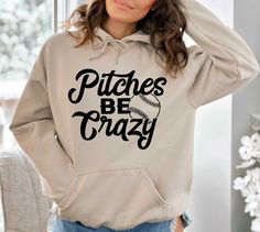 Pitches Be Crazy Hoodie, Women Baseball Hoodie,Softball Hoodie,Baseball Top Hoodie, Baseball Game Hoodie, Funny Sports Hoodie,  Baseball Hoodie, Baseball Lover Hoodie, Funny Baseball Hoodie   PRODUCT DETAILS 💫Youth Hoodies do not have drawcord for added safety💫 - Our hoodies are made for comfort with a 50% cotton and 50% polyester blend. - They're built to last with a medium-heavy fabric  (8.0 oz/yd² (271 g/m - Enjoy a relaxed fit and a sewn-in label. - Get the right size with our true-to-size Sporty Hooded Hoodie For Baseball Season, Long Sleeve Baseball Fan Hoodie, Baseball Season Sports Hoodie, Sports Fan Hoodie With Letter Print, Hooded Hoodie For Baseball Season, Long Sleeve Hoodie For Baseball Season Sports Events, Hooded Sweatshirt For Baseball Season, Pitches Be Crazy, Baseball Tops