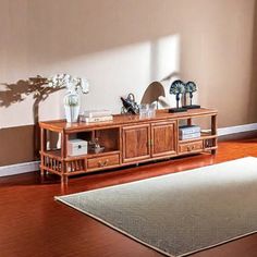 a living room scene with focus on the coffee table and rug in the foreground