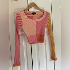 Soft And Stretchy Ribbed Cropped Sweater. Like New, Never Worn. Pink Stretch Patchwork Tops, Pink Long Sleeve Top With Contrast Color, Fitted Multicolor Contrast Top, Fitted Multicolor Contrast Color Top, Pink Long Sleeve Crop Top For Winter, Trendy Pink Ribbed Crop Top, Pink Fitted Patchwork Top, Pink Color Block Top For Fall, Fitted Color Block Pink Top