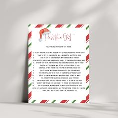 a christmas letter to santa claus on the inside of a red, green and white striped envelope