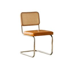 a brown chair with a metal frame and seat cushion on the back, in front of a white background