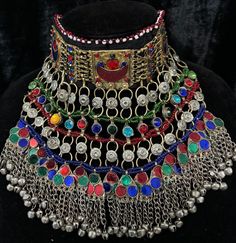 Exquisite Afghan Jewelry Set - Perfect for Special Occasions🇦🇫 Add a touch of exotic elegance to your look with our stunning Afghan jewelry set. Handcrafted by skilled artisans, each piece is a unique work of art that captures the rich cultural heritage of Afghanistan. This set includes a dazzling necklace, matching earrings, and a Tikka headpiece, all intricately designed with traditional Afghan motifs and embellished with vibrant Multicoloured gemstones. Ceremonial Multicolor Metal Jewelry, Multicolor Heavy Jewelry For Celebration, Multicolor Celebration Jewelry, Bohemian Multicolor Tilla Choker, Adjustable Multicolor Ceremonial Jewelry, Adjustable Multicolor Necklace For Ceremonial Occasions, Multicolor Metal Jewelry For Festivals, Ceremonial Multicolor Jewelry, Adjustable Multicolor Jewelry For Ceremonial Occasion