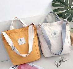 Purpose: portable/single shoulder/crossbody Fabric: High-quality thick canvas Size: length 33cm * width 14cm * height 35cm (12.9* 5.5* 13.7 inches) Color: black/white/pink/yellow/gray The length of the shoulder strap is adjustable, and the portable design is convenient and practical Zipper opening design, safe and not easy to fall There are small pockets on the left and right sides and the front, you can put some small items in order to distinguish Wear-resistant fabric, evenly routed, beautiful appearance The internal capacity is large, which can store mobile phones, umbrellas, iPads, mobile power supplies, etc. Since it is a manual measurement, please allow us to have an error of 2-3cm. Because the display is different and the light is different, the product may have color difference. Korean Tote Bag, Fabric Bag Design, Big Crossbody Bag, Pochette Diy, Sacs Tote Bags, Canvas Bag Design, Opening Design, Diy Bags Patterns, Modern Bag