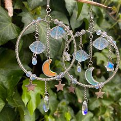 Material: Metal Celestial Metal Hoop Earrings, Celestial Adjustable Hoop Earrings, Adjustable Celestial Hoop Earrings, Celestial Metal Dangle Hoop Earrings, Celestial Style Metal Dangle Hoop Earrings, Celestial Star-shaped Hoop Earrings, Handmade Celestial Dangle Hoop Earrings, Celestial Hoop Earrings With Ear Wire, Celestial Star-shaped Hoop Earrings With Moon Charm